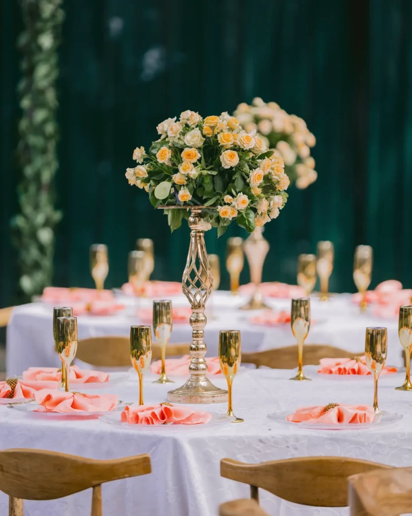 Cream roses above a celebration tablescape