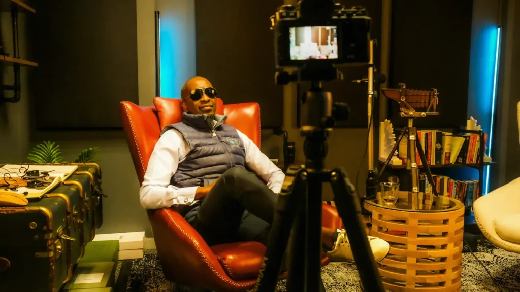Service illustration: a Black man being filmed in a studio
