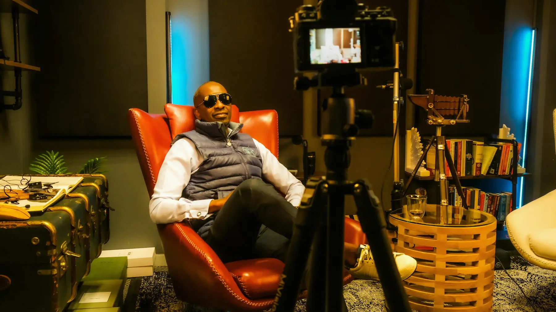 Service illustration: a Black man being filmed in a studio