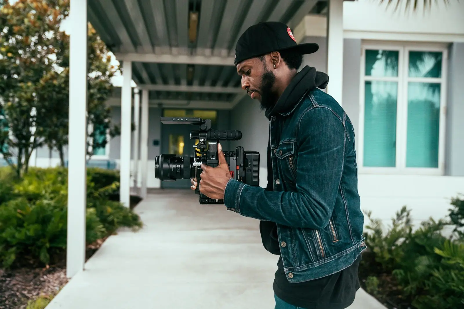 Camera operator filming outdoors — production illustration